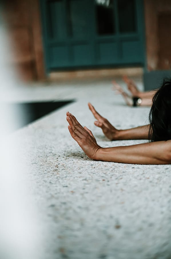 women in child's pose yoga