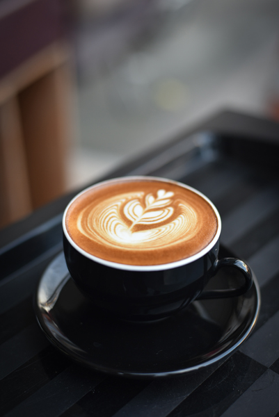 A cup of coffee on a black table
