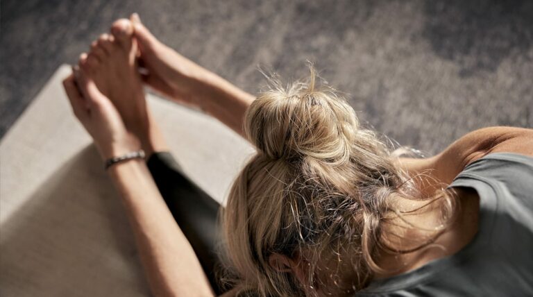 woman stretching for pilates