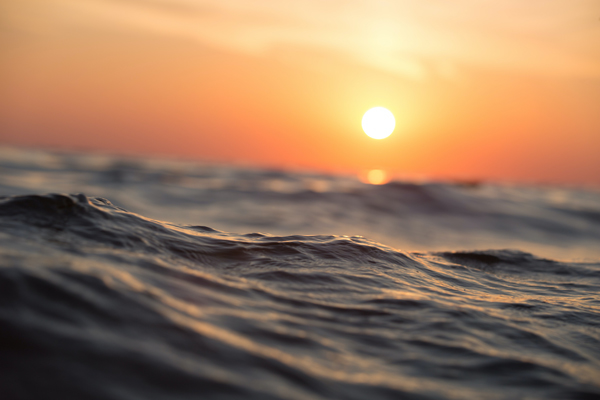 Sunset with the sea in the close foreground