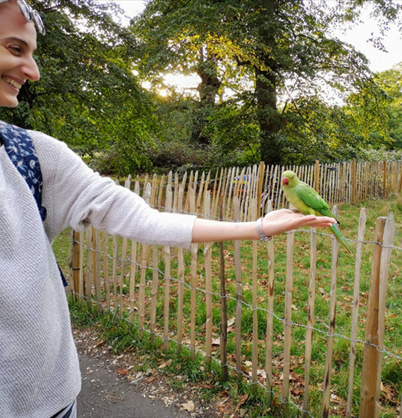 Woman holding a parrot