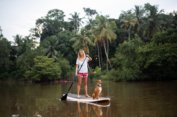 Woman and dog on paddle board