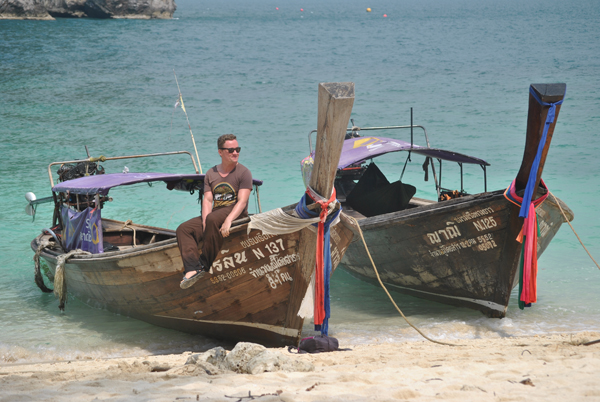 Man on boats in Asia