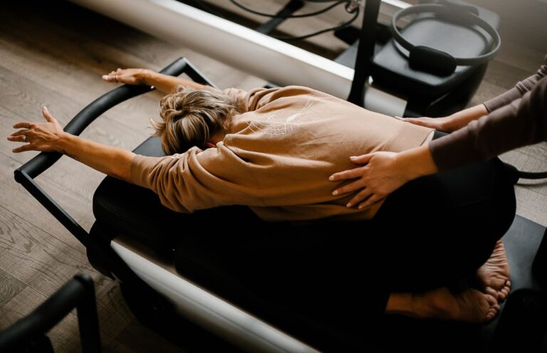Personal Trainer making hands on adjustments