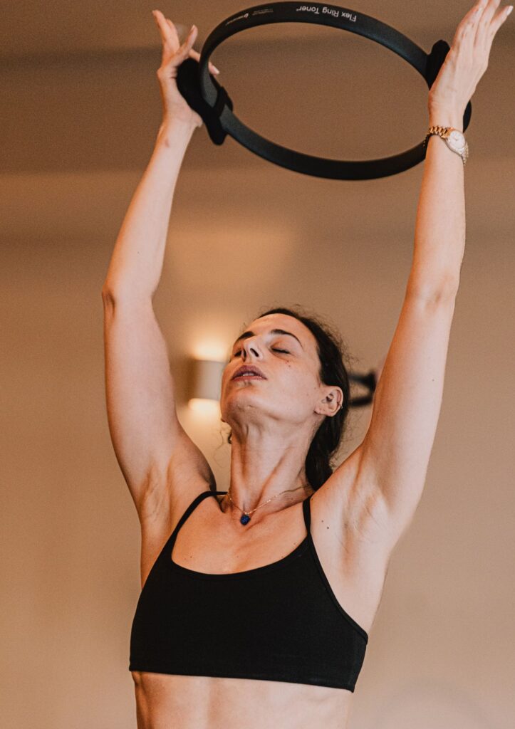 Women exercising with Pilates ring
