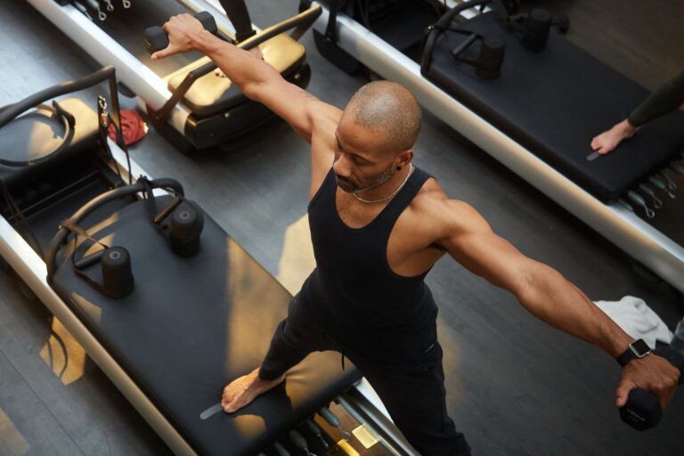 Heartcore teacher Nick practicing reformer Pilates